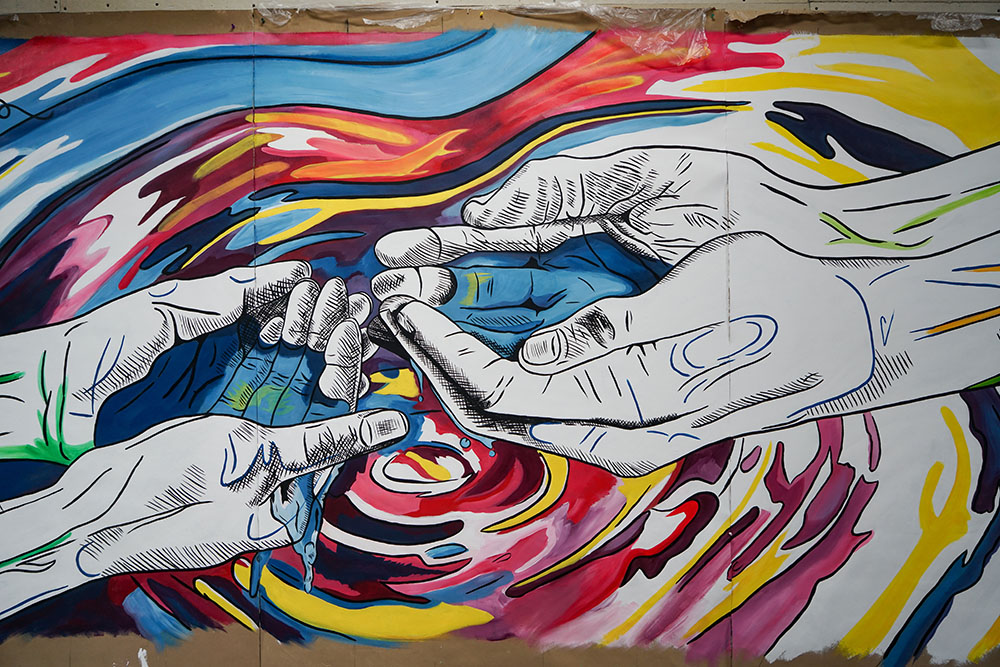 Section of Mural Art with Hands Representing an Isthmus